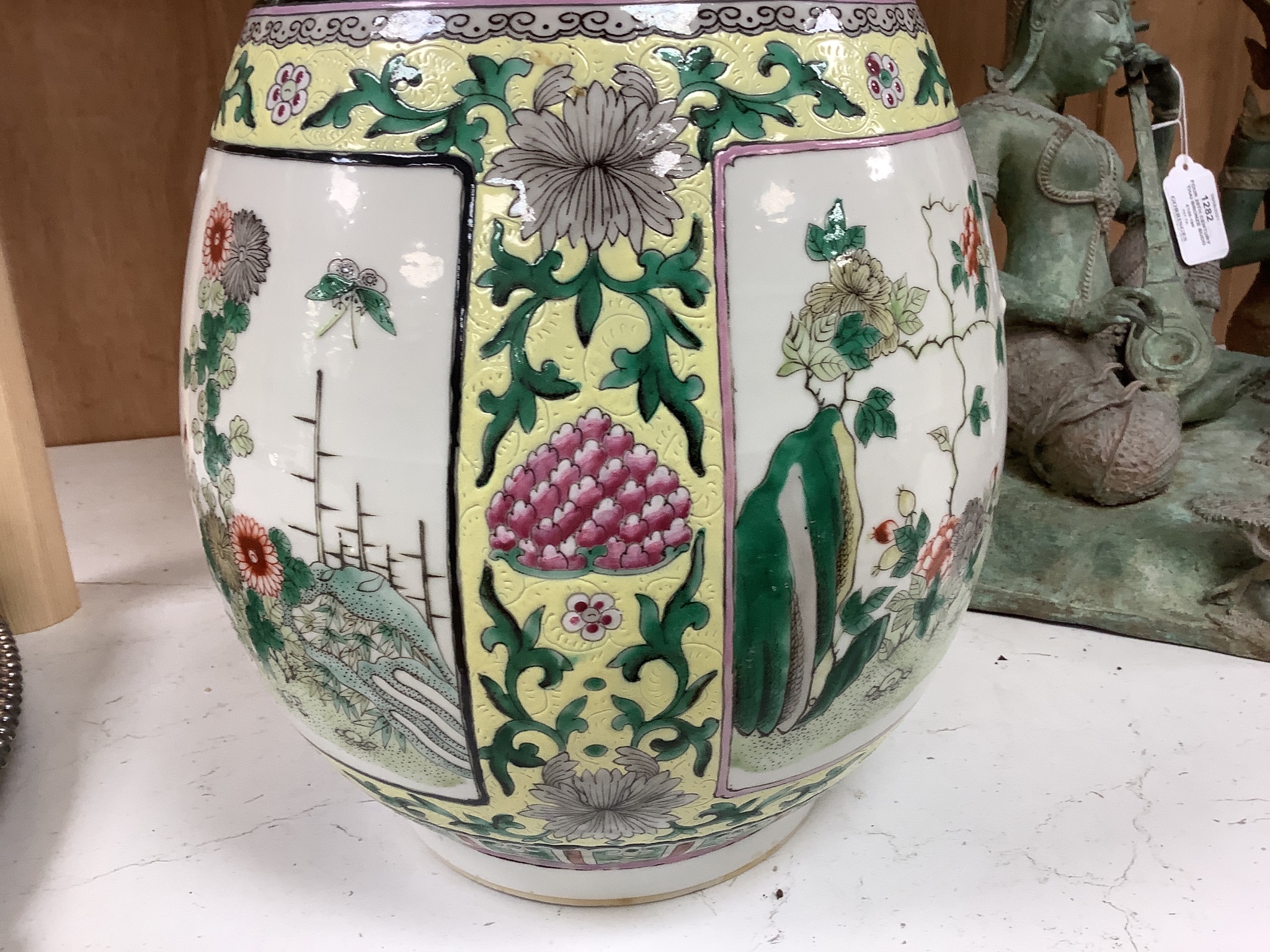 A large 19th century Chinese famille verte yellow ground bottle vase, height 47cm, restorations
